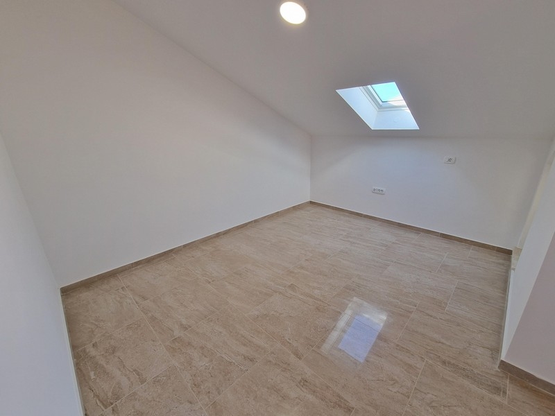 Hálószoba a tetőtérben.