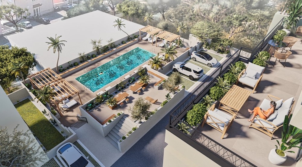 Ingatlan Horvátországban, Makarskában, tengerre néző apartman: madártávlatból egy modern lakókomplexum medencével, napozóterasszal és parkolóhellyel