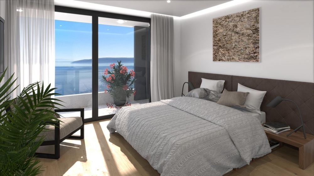 Hálószoba nagy ablakkal és kilátással a tengerre