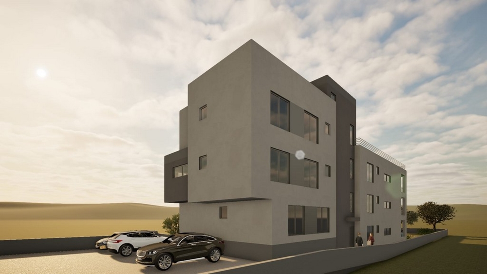 Új lakóépület, az épület előtt parkolóhellyel