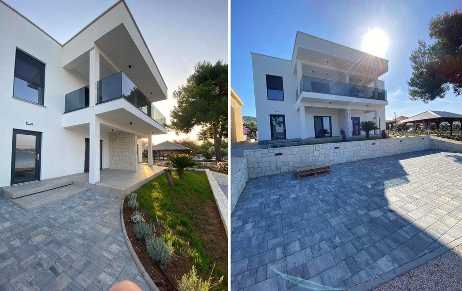 Modern villa földszinti lakással és kövezett autóúttal