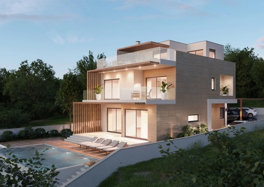 Egy modern ingatlan légi felvétele Horvátországban, villa tengerre néző éjszakai kilátással