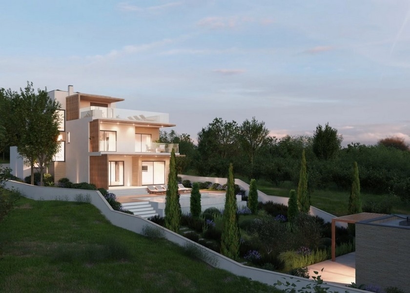 Hangulatos nappali kandallóval egy modern villában Horvátországban, kilátással a tengerre alkonyatkor