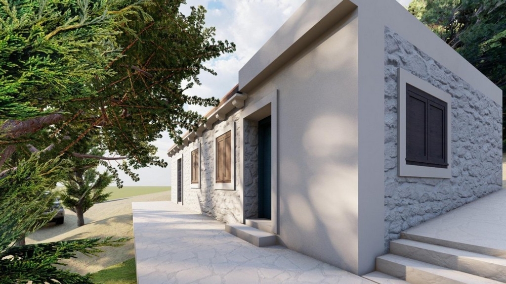 Ház természetes kőhomlokzattal és tágas szabadtéri területtel